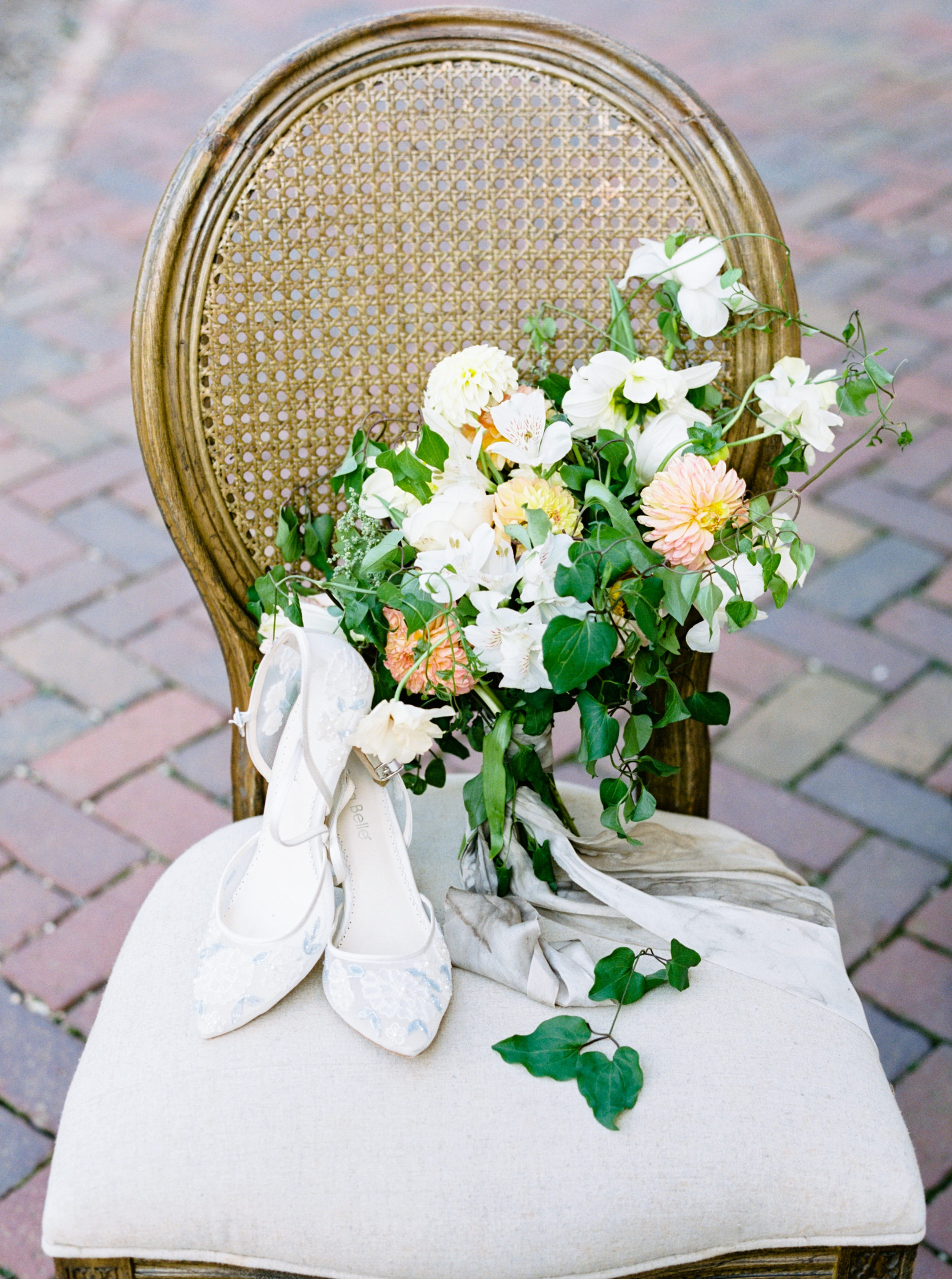 shoes and bouquet on chair