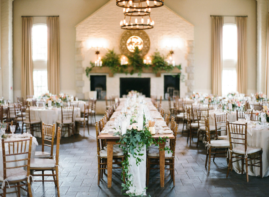 long wedding table with fireplace in background